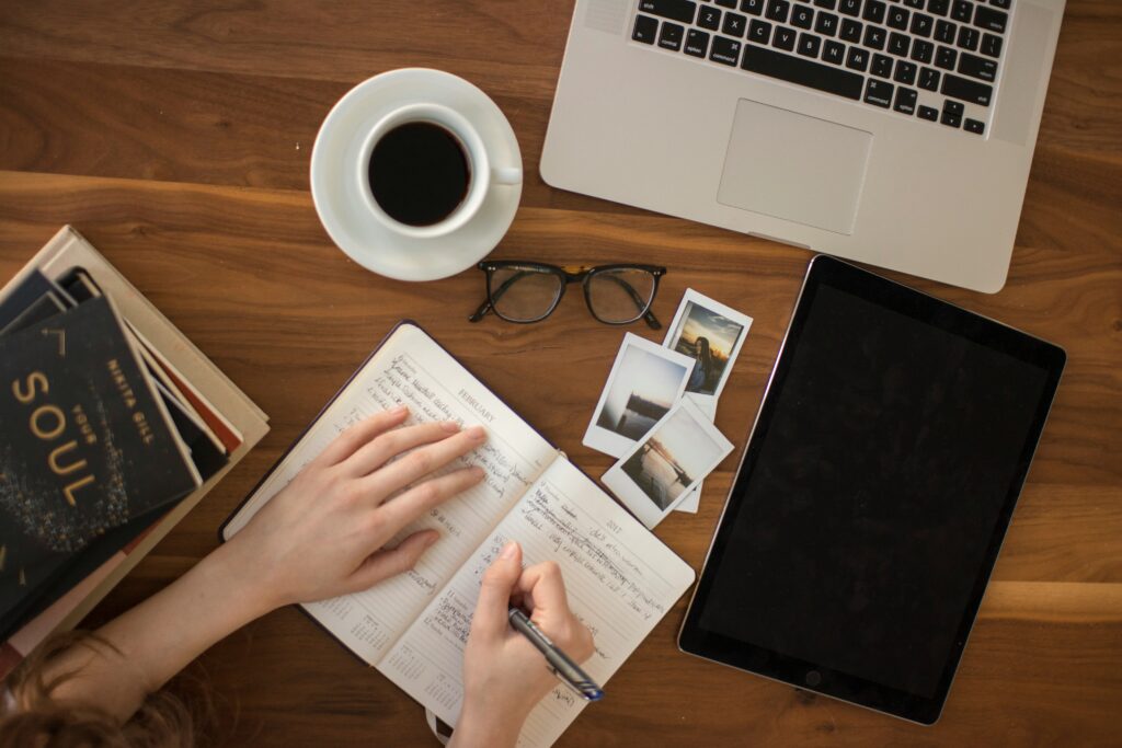 Person writing in a planner